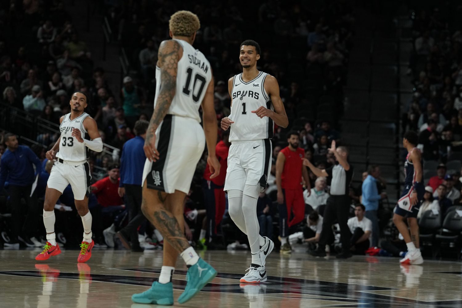 Jan 29, 2024; San Antonio, Texas, USA; San Antonio Spurs center Victor Wembanyama (1) smiles at San Antonio Spurs forward Jeremy Sochan (10) in the second half against the Washington Wizards at Frost Bank Center.